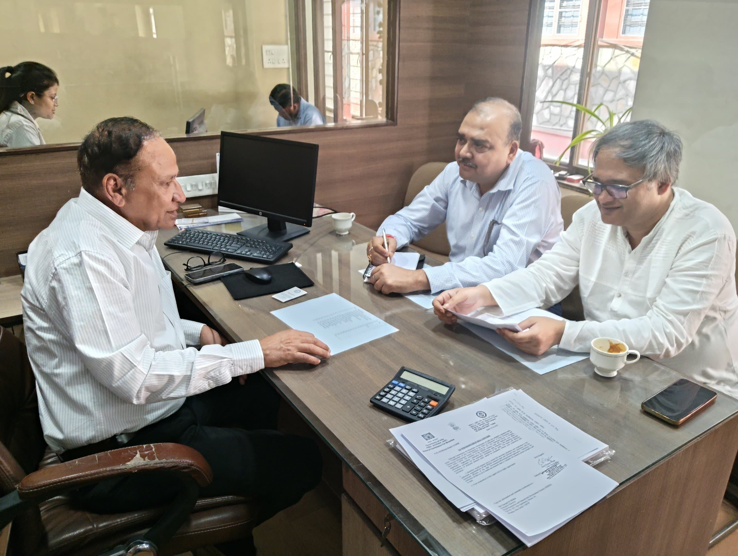 Evaluation team reviewing field evidence and programme data